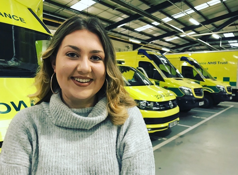 Charlie Wainwright next to Ambulances.