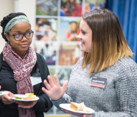 Two event attendees having a chat.