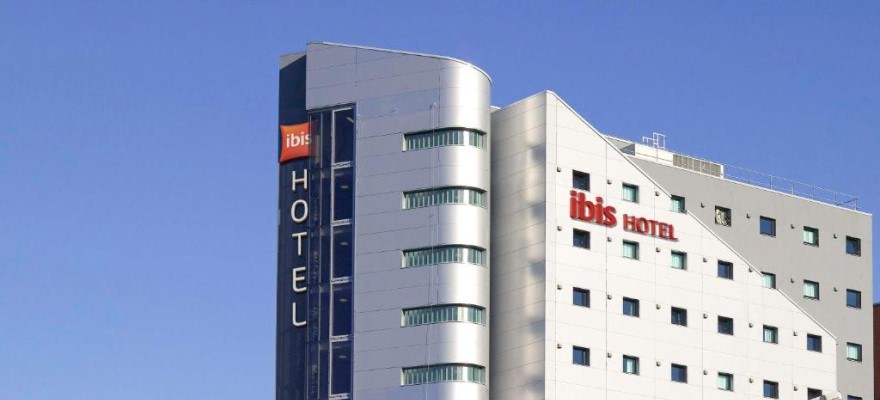 multi storey hotel building with blue sky.