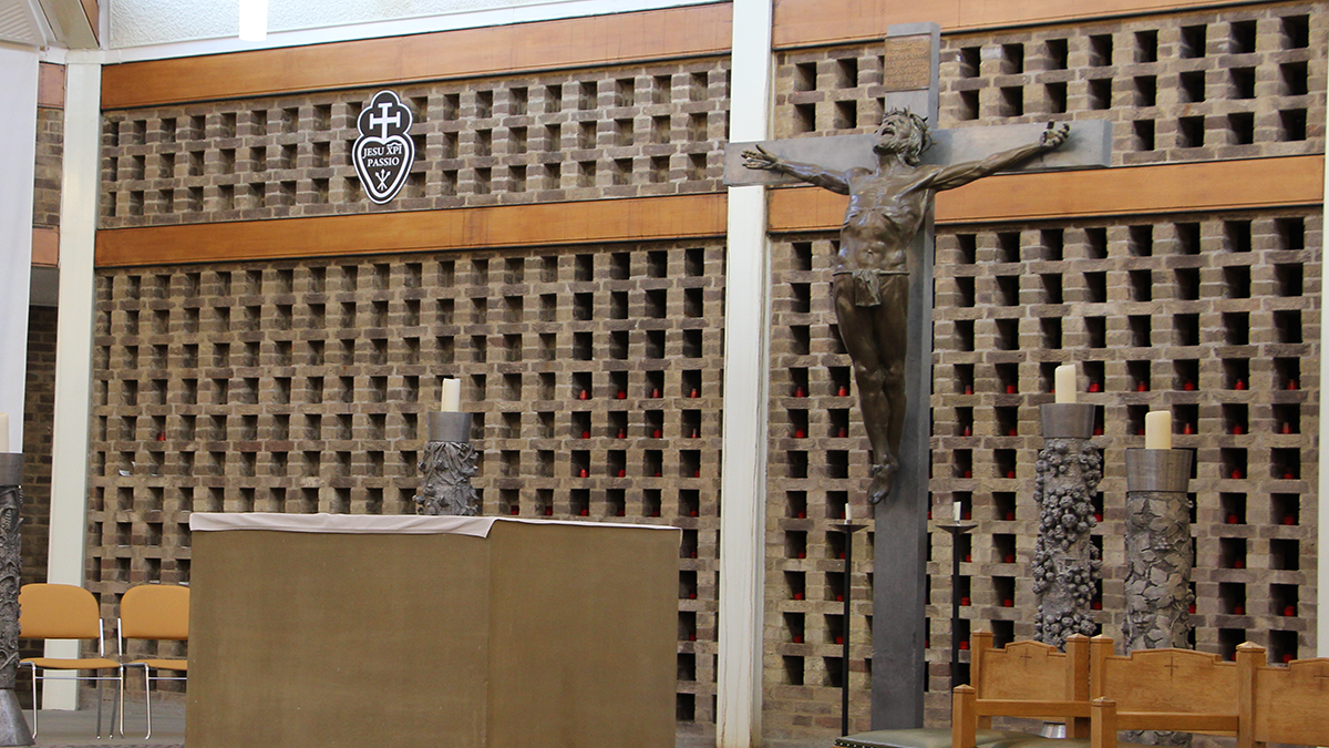 The chapel at Leeds Trinity University with a statue of Jesus on the cross..