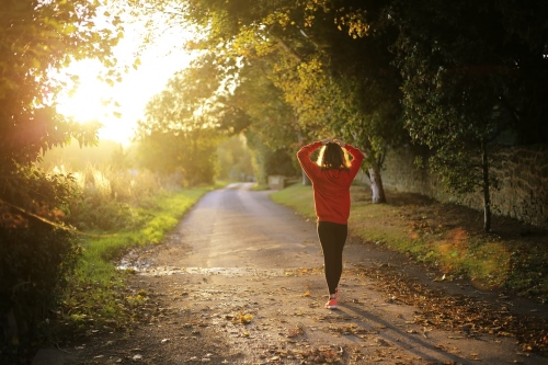 Woman walking along a country path