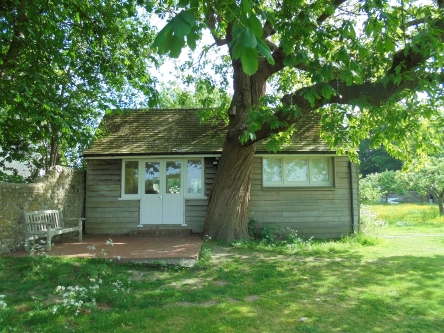 A lodge behind a tree .