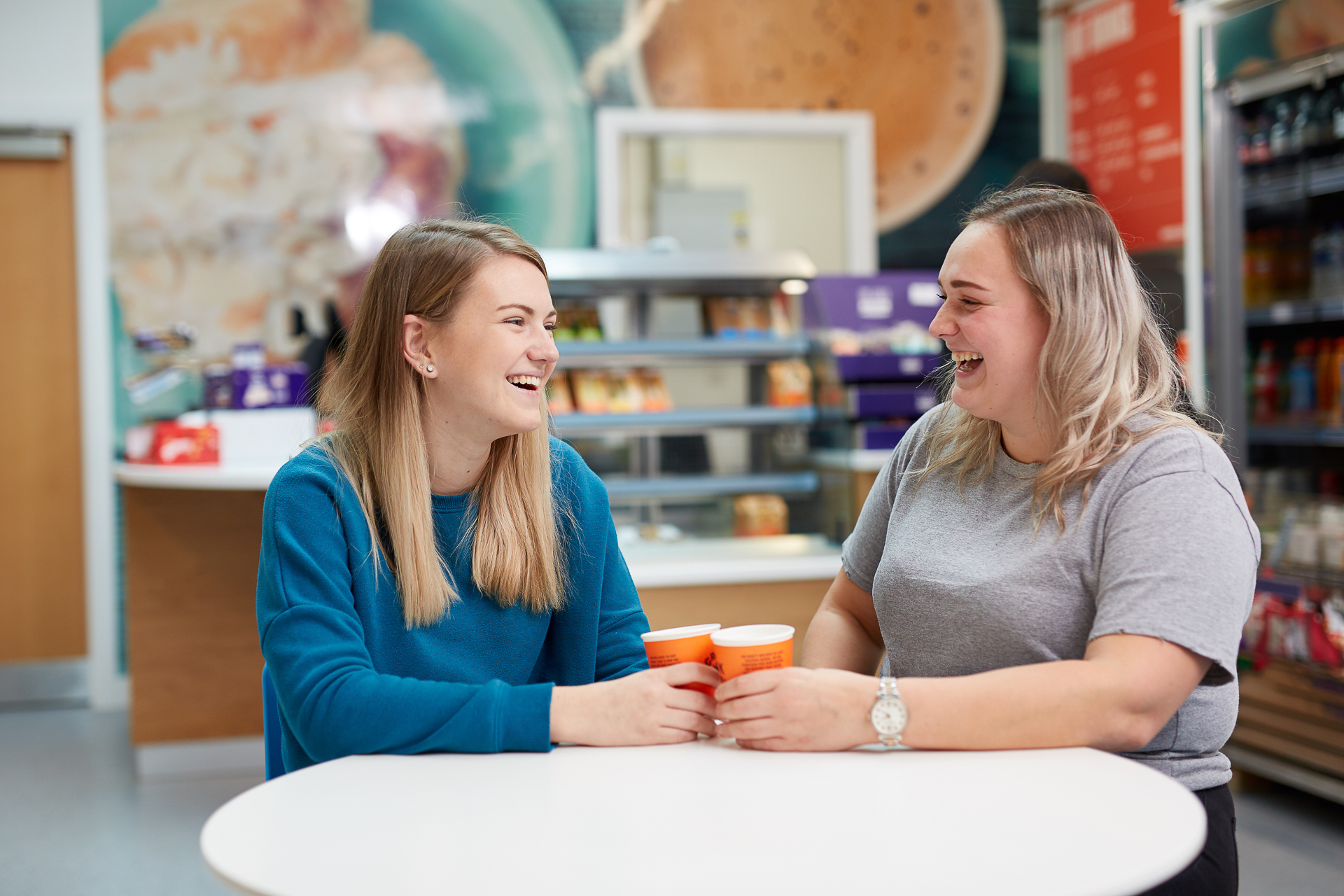 Peer Support Champions chatting in the Andrew Kean Learning Centre.