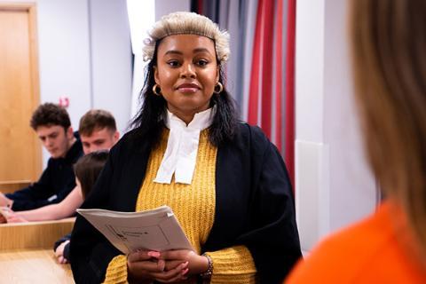 A law student taking part in a moot court.