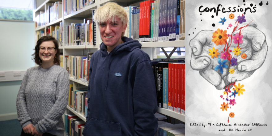 Two students stand in front of bookcase.