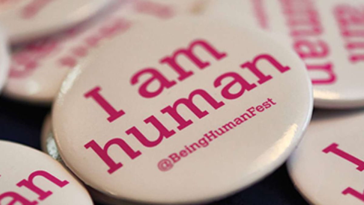 A badge with the words I am human.