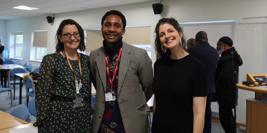 Female on the left, man in the middle and a female to the right at a community event.