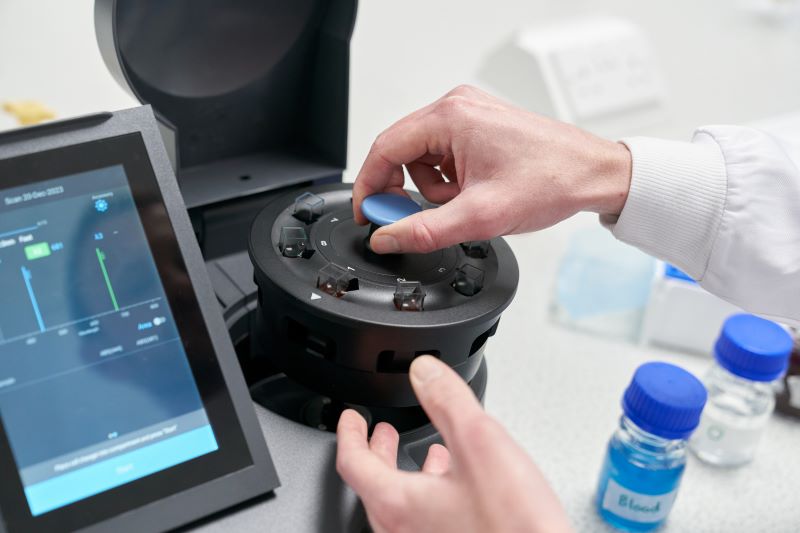 Loading a carousel into a spectrophotometer..