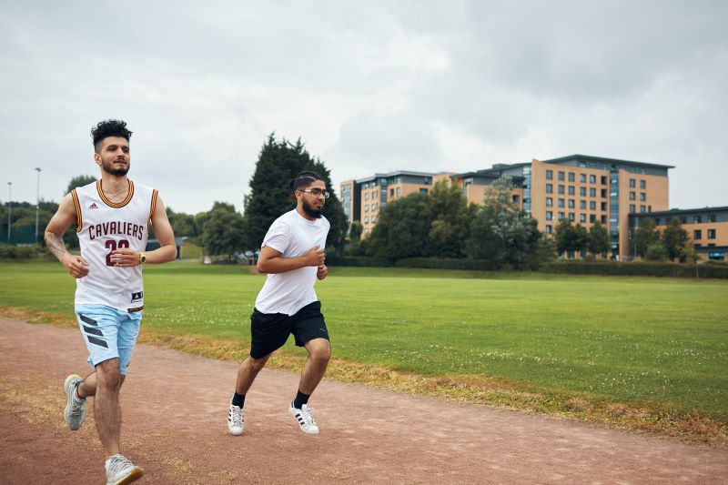 Image of students on the running track..