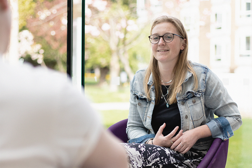 Health and Social Care student Jemma Ryley sits in the Atrium at Main Campus.