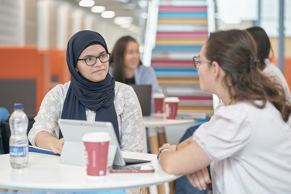 Students drinking Costa Coffee in the AKLC.