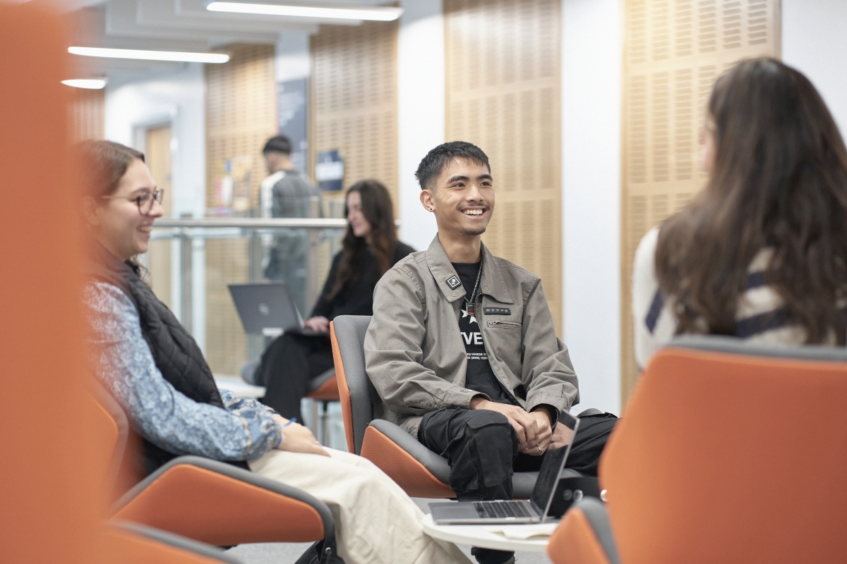 Students chatting and studying in the Andrew Kean Learning Centre..