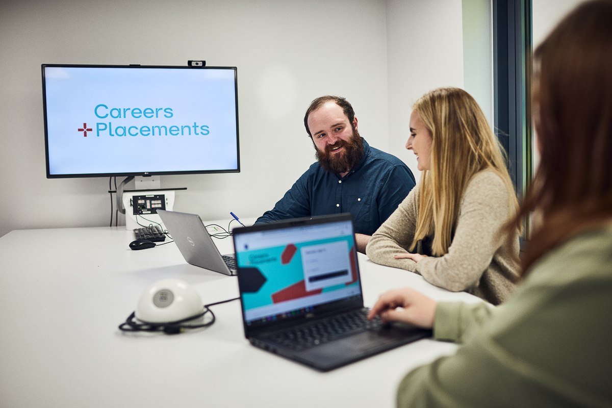 Students speaking with staff from the Careers and Placements team.