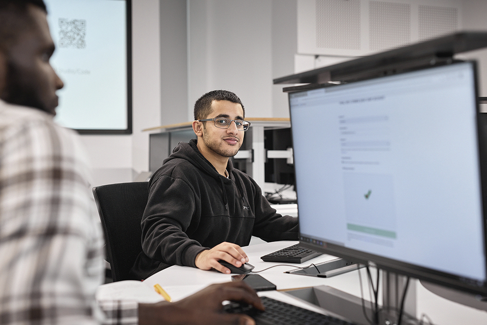 Computer Science student working at a computer.