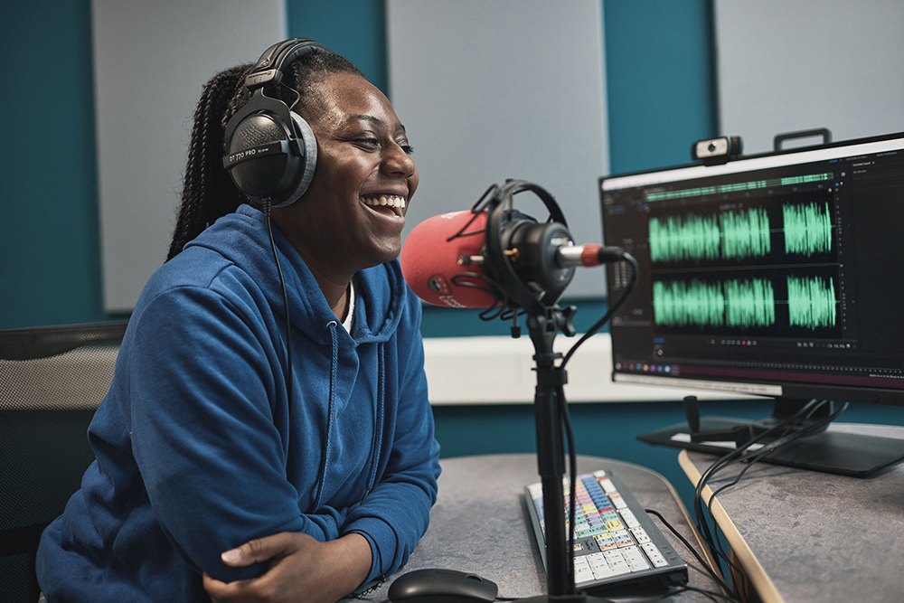 Student working in radio studio.