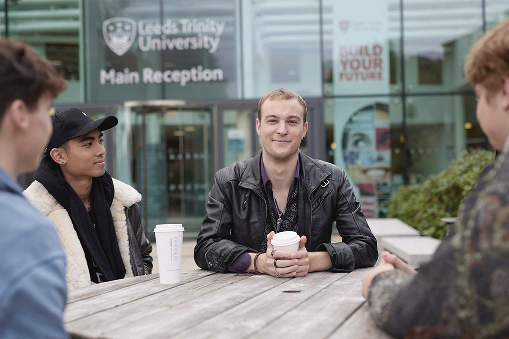 Students drinking Starbucks outside the Atrium.